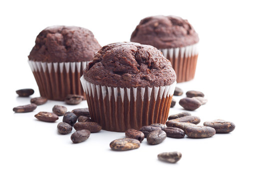 The tasty chocolate muffin and cocoa beans.