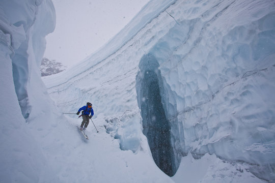 A man backountry skiing through a glacier, Icefall Lodge, Golden, British Columbia, Canada
