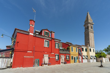 Colorful residential buildings and campanile in Burano island, Venice, Italy