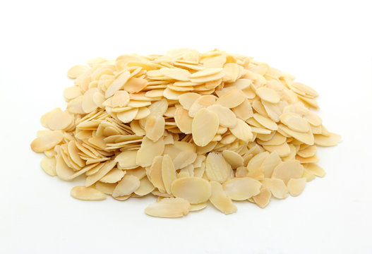 Pile of sliced almonds on white background