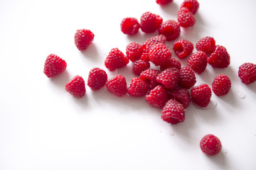 Fresh raspberries, white background
