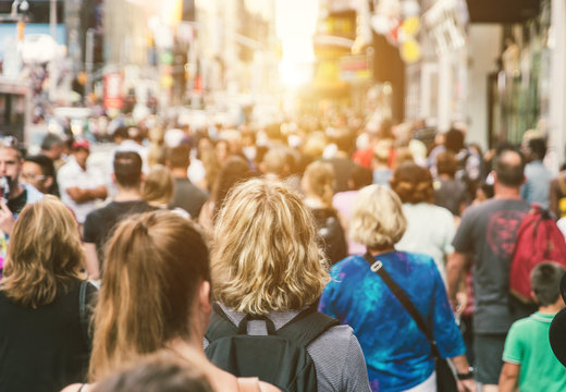 Unrecognizable Mass Of People Walking In The City