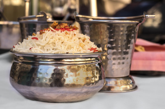 Bowl of traditional Indian rice on blurred background