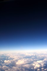 Fototapeta na wymiar flight above clouds, ultraviolet sky, photo toned