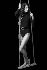 Fototapeta na wymiar Portrait of beautiful caucasian model posing on black 