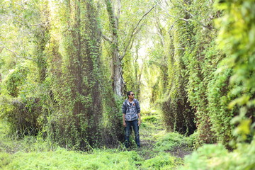 Man and Green Wetland Forest in Rayong at Thailand