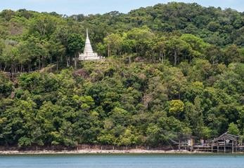 Fototapeta na wymiar White pagoda on Mountain Laem Sing at estuary Laem Sing, Chanthaburi, Thailand.