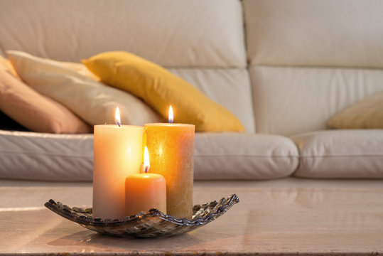 Lit Candles On A Marble Table