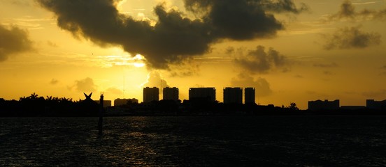 cloudy colorful sunrise. cityscape at horizon. photo toned