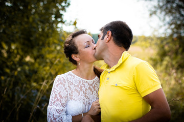 Fototapeta premium Beautiful couple outdoors in a summer day