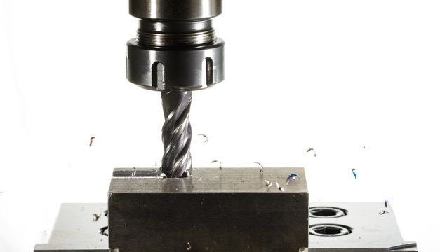 cnc milling machine - spindle with cutter, flying metal splinter