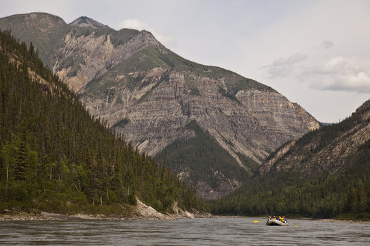 Raft enters third canyon on Nahanni River, Nahanni National Park Preserve, NWT, Canada.