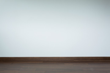 empty room interior, brown wood laminate floor and white mortar