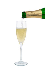from the bottle is poured into a glass of champagne
