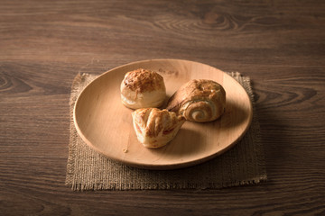 Fototapeta na wymiar Cookies on the wooden plate