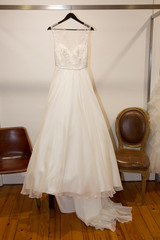 Fototapeta na wymiar wedding dresses in bridal salon on mannequin