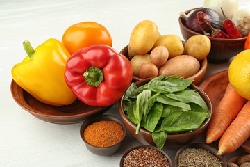 Vegetables and spices on wooden table