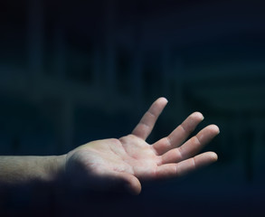 Businessman hand on black dark background