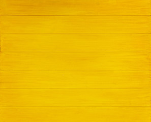 Naklejka premium Yellow wooden background