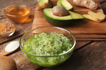 Natural ingredients for homemade facial scrub on wooden background