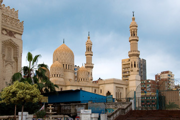 Tower minaret against a bright blue sky, Alexandria, Egypt
