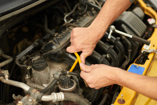 Mechanic Use Wrench For Change Spark Plugs.