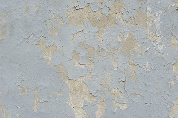 Wall fragment with scratches and cracks