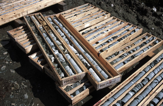 Emerald mining. Drilled mineral cores stacked in boxes, part of the process to determine productive emerald mining areas. True North Gems, Yukon Territory, Canada