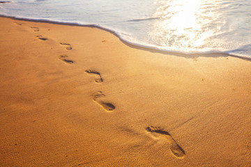 Obraz na płótnie Canvas beach, wave and footprints