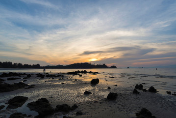 Obraz na płótnie Canvas The rocky beach during sunset light, Thailand