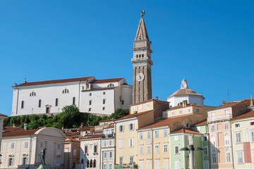 Fototapeta na wymiar Church of St. George in Piran surrounded by mediterranean houses