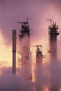Petrochemical refinery at sunrise - Towers sillouette, British Columbia, Canada.