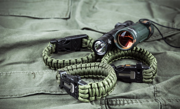 Military paracord bracelet, tactical torch and spy-glass Stock