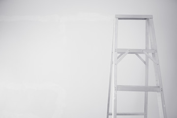 Ladder on white wall.black and white tone.Selective focus.