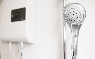 shower head and water heater background in bathroom.Selective focus.