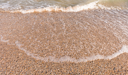 Fototapeta na wymiar soft waves on seashore