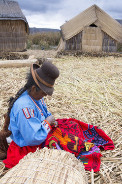 Local residents of floating reed islands of Uros, Lake Titicaca, Peru