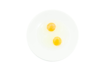 Raw egg yolks in a white bowl isolated on white  background, To prepare for a high protein diet has helped in the growth of a person's body