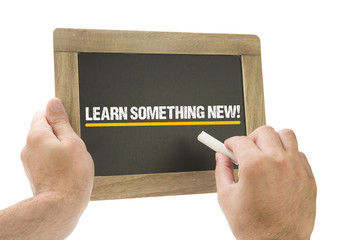 Learn something new! Hand writing on chalkboard