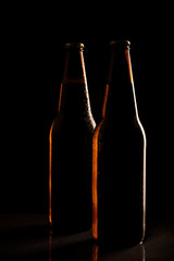 Beer bottles silhouette isolated on black background