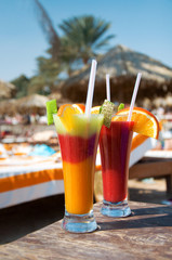 cocktails from fresh fruit in a tall glass with tubes