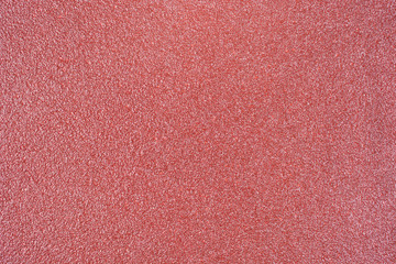 Fototapeta premium Red sand paper texture background