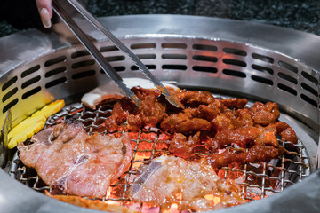 Beef and Pork grill on hot coals. This kind of food is a Korean BBQ style.
