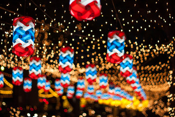Obraz premium Christmas and New Year's celebrations, decorated with lights, Bokeh background.