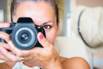 smiling woman with digital camera