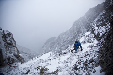 A man alpine climbing - Coire Dubh Integrale 5.7, WI3, Canmore, Alberta, Canada