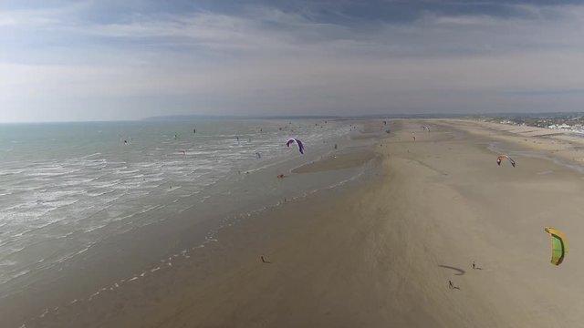 Kitesurfers on a Beach
