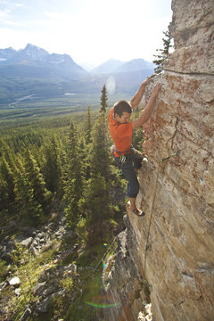 A strong male climber climbing, RUDED2 10d, Silver City, Castle Mtn, Banff, AB