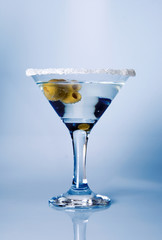 glass of martini with olives
