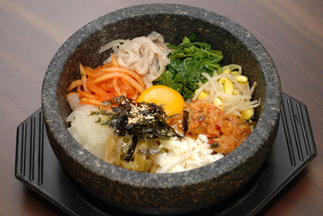 Rice with vegetable in hot bowl Korean food